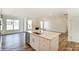 Open concept kitchen with island, stainless steel appliances, and hardwood floors at 8631 Frank Grier Rd # 6, Charlotte, NC 28215