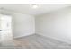 Cozy bedroom featuring grey carpet and access to another room at 8631 Frank Grier Rd # 6, Charlotte, NC 28215