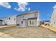 Two-story house with gray siding and backyard at 8631 Frank Grier Rd # 6, Charlotte, NC 28215