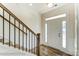 Bright entryway with staircase and wood railing at 8631 Frank Grier Rd # 6, Charlotte, NC 28215