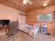 Small bedroom with a white metal bed frame and desk at 6860 Shade Tree Ln, Sherrills Ford, NC 28673