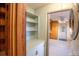 Functional laundry room with washer, dryer, and built-in shelving at 3616 County Home Rd, Conover, NC 28613