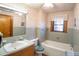 Bathroom with light green tile, vanity, and bathtub at 3616 County Home Rd, Conover, NC 28613