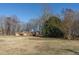Brick house with a large yard and mature trees at 3616 County Home Rd, Conover, NC 28613
