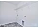 Laundry room with wire shelving and gray tile floor at 105 Megby Trl, Statesville, NC 28677