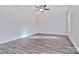 Spacious bedroom featuring wood-look floors and a ceiling fan at 105 Megby Trl, Statesville, NC 28677