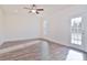 Bright bedroom with wood-look floors and sliding glass door to patio at 105 Megby Trl, Statesville, NC 28677