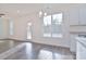 Bright dining area with hardwood floors and view to backyard at 105 Megby Trl, Statesville, NC 28677