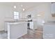 Modern kitchen with white cabinets, granite countertops and island at 105 Megby Trl, Statesville, NC 28677