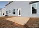 New concrete patio in the backyard of a new construction house at 105 Megby Trl, Statesville, NC 28677