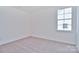 Simple carpeted bedroom with a window at 105 Megby Trl, Statesville, NC 28677