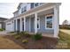 Charming front porch with white columns and landscaping at 105 Megby Trl, Statesville, NC 28677