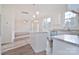 Open kitchen with island, stainless steel appliances, and hardwood floors at 105 Megby Trl, Statesville, NC 28677