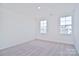 Bright bedroom with carpet flooring and two large windows at 105 Megby Trl, Statesville, NC 28677