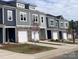 Modern townhouses with gray siding and white garage doors at 2773 Ruby Mill Dr # 41, Gastonia, NC 28056