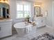 Spa-like bathroom with a soaking tub, double vanities, and modern fixtures at 833 Lake Forest Dr # Covington, Belmont, NC 28012