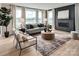 Living room featuring a dark brick fireplace and plenty of natural light at 833 Lake Forest Dr # Covington, Belmont, NC 28012