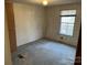 Simple bedroom with window and neutral carpeting at 60 Shadowwood Dr, Taylorsville, NC 28681