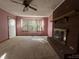 Living room with brick fireplace and carpeted floors at 201 Belt Dr, Gastonia, NC 28056