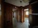 Long hallway with wood paneling and access to other rooms at 201 Belt Dr, Gastonia, NC 28056