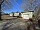 Side view of ranch house with attached garage at 201 Belt Dr, Gastonia, NC 28056