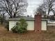Rear exterior view of house with brick chimney at 201 Belt Dr, Gastonia, NC 28056