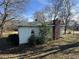 Side view of ranch house, green siding, brick base at 201 Belt Dr, Gastonia, NC 28056
