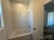 Bathroom with white subway tile and bathtub at 5217 Glenwalk Dr # 0059, Charlotte, NC 28269