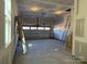 Spacious unfinished garage with overhead door and window at 5217 Glenwalk Dr # 0059, Charlotte, NC 28269