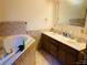 Bathroom with double vanity, soaking tub, and tile flooring at 187 Newland Ln, Statesville, NC 28625
