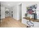 Light and bright hallway with wood floors and modern decor at 934 Laurel Creek Ln, Charlotte, NC 28211