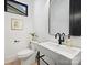 Stylish powder room featuring a contemporary sink and black accents at 934 Laurel Creek Ln, Charlotte, NC 28211