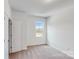 Spacious bedroom with carpet and a window at 224 Winford Dr, Troutman, NC 28116