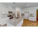 Modern kitchen with white cabinets, granite island, and stainless steel appliances at 224 Winford Dr, Troutman, NC 28116