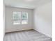 Well-lit bedroom featuring two windows at 224 Winford Dr, Troutman, NC 28116