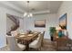 Formal dining room with a rustic wooden table at 224 Winford Dr, Troutman, NC 28116