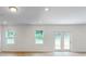 Bright living room with hardwood floors, double doors leading to the backyard at 224 Winford Dr, Troutman, NC 28116
