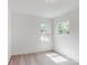 Charming bedroom with two windows and carpet at 224 Winford Dr, Troutman, NC 28116