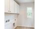 Laundry room with upper cabinets and built-in shelving at 230 Winford Rd, Troutman, NC 28166