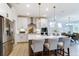Open concept kitchen boasts an island and stainless steel appliances at 4062 Red Gate Ave # 4, Harrisburg, NC 28075