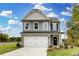 Two-story house with gray siding and stone accents at 4062 Red Gate Ave # 4, Harrisburg, NC 28075