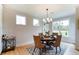 Bright dining room with large windows and hardwood floors at 4062 Red Gate Ave # 4, Harrisburg, NC 28075