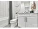 Clean bathroom with white vanity, geometric tile floor, and bathtub at 1424 Hamilton St # 12, Charlotte, NC 28206