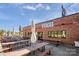 Outdoor patio with picnic tables and umbrellas at 1424 Hamilton St # 12, Charlotte, NC 28206