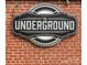 Close-up of 'The Underground' sign on brick wall at 1424 Hamilton St # 12, Charlotte, NC 28206