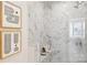 Walk-in marble shower with built-in seat and glass enclosure at 1424 Hamilton St # 12, Charlotte, NC 28206