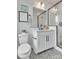 Modern bathroom with white vanity, geometric tile floor, and glass shower at 1424 Hamilton St # 12, Charlotte, NC 28206