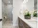 Double vanity bathroom with marble shower and modern fixtures at 1424 Hamilton St # 12, Charlotte, NC 28206