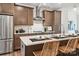 Modern kitchen with stainless steel appliances and an island at 1424 Hamilton St # 12, Charlotte, NC 28206