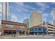 A street view of buildings, including a restaurant and tall office buildings at 1424 Hamilton St # 12, Charlotte, NC 28206